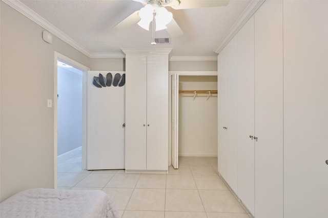 801 River Rd Unit 105D, Montgomery, TX 77356 - bedroom with visible vents, ornamental molding, and light tile patterned floors
