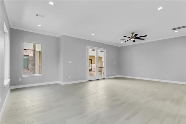 empty room featuring recessed lighting, french doors, visible vents, and wood finished floors