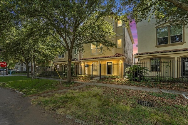 2208 Colorado St, Houston, TX 77007 - townhome / multi-family property with stucco siding and a tiled roof