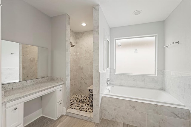 2208 Colorado St, Houston, TX 77007 - full bathroom with tiled shower, a bath, wood finished floors, and vanity
