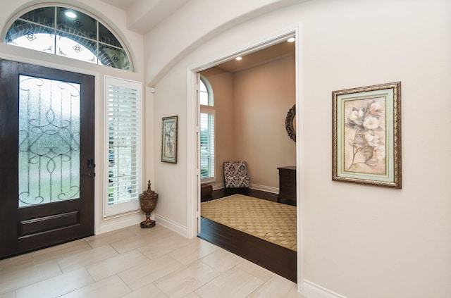 entryway featuring baseboards