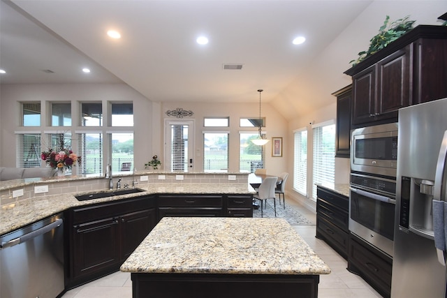 kitchen featuring a healthy amount of sunlight, visible vents, appliances with stainless steel finishes, and a sink