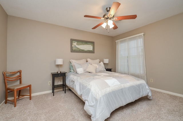bedroom featuring baseboards, a ceiling fan, and light carpet