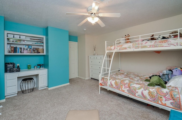 bedroom with carpet floors, a textured ceiling, and ceiling fan
