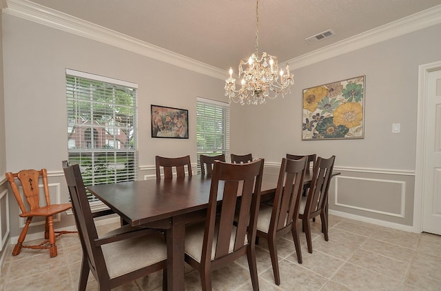 dining area with visible vents, crown molding, a chandelier, a decorative wall, and light tile patterned flooring