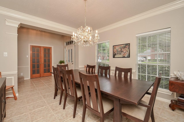 dining area with crown molding, baseboards, french doors, light tile patterned floors, and a notable chandelier