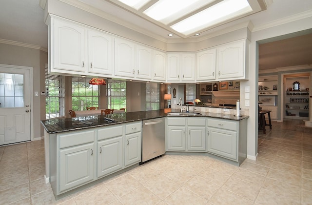 kitchen featuring a sink, light tile patterned floors, and stainless steel dishwasher