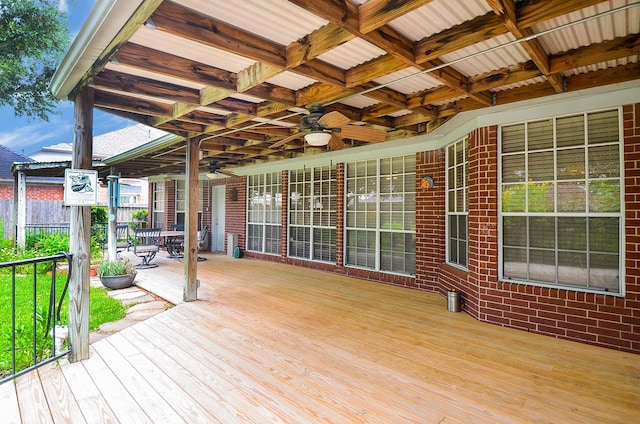 wooden deck with a ceiling fan
