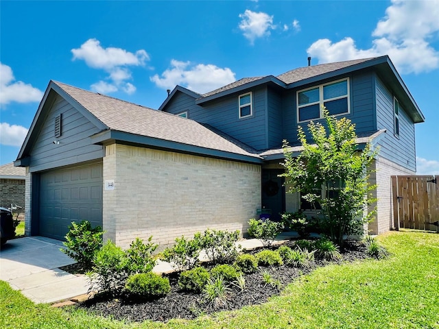 view of front of home featuring brick siding, fence, a shingled roof, and a garage