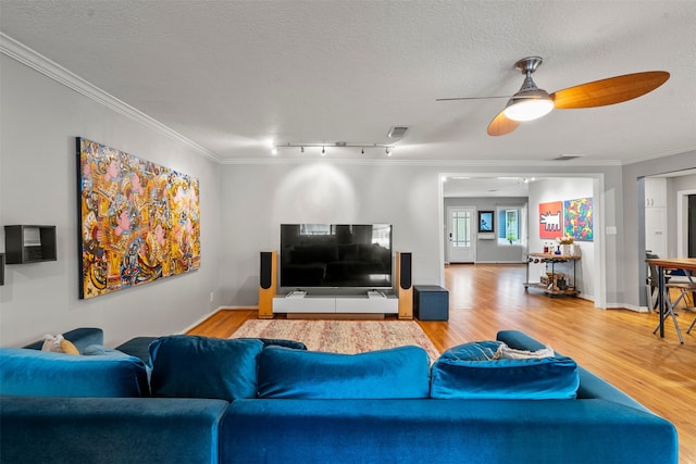 4811 Saxon St, Bellaire, TX 77401 - living room featuring crown molding, ceiling fan, visible vents, and wood finished floors