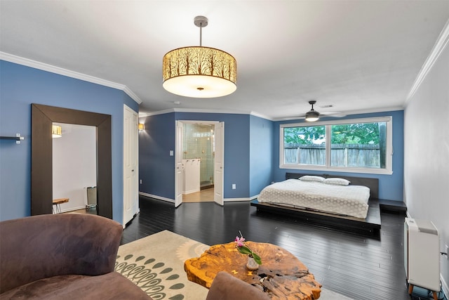 4811 Saxon St, Bellaire, TX 77401 - bedroom with baseboards, heating unit, wood finished floors, ensuite bathroom, and ornamental molding