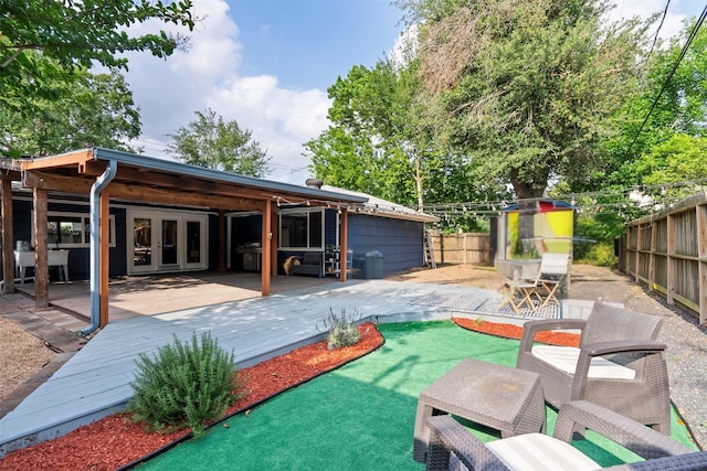 4811 Saxon St, Bellaire, TX 77401 - exterior space featuring a grill, french doors, a fenced backyard, and a wooden deck