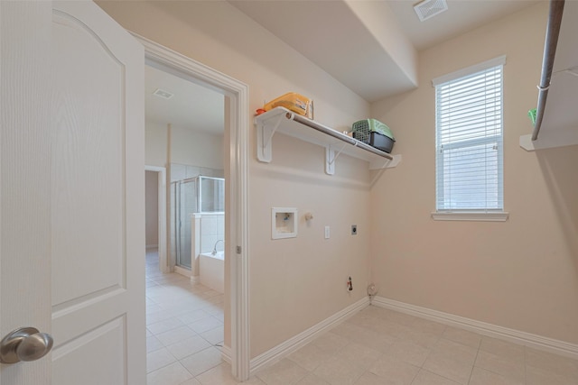 clothes washing area featuring laundry area, visible vents, a healthy amount of sunlight, and gas dryer hookup