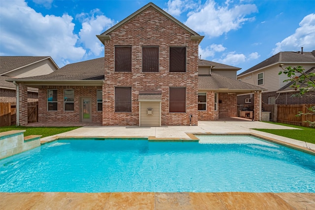 view of swimming pool with a fenced in pool, a fenced backyard, and a patio area