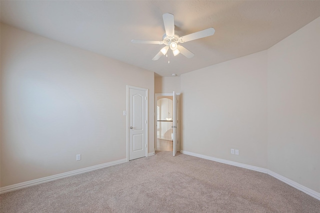 unfurnished bedroom with baseboards, carpet flooring, and a ceiling fan
