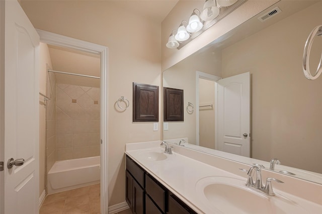 bathroom with visible vents, a sink, baseboards, and double vanity