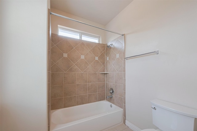 bathroom with shower / bath combination, baseboards, and toilet