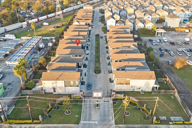 birds eye view of property with a residential view