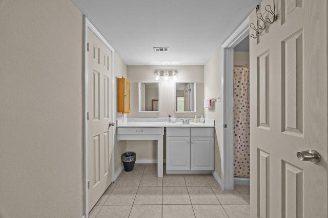 2234 Kelly Dr, Pearland, TX 77581 - full bath featuring tile patterned floors, vanity, baseboards, and curtained shower