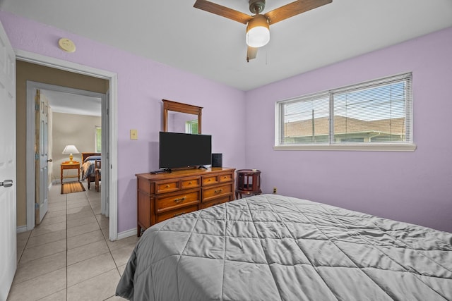 2234 Kelly Dr, Pearland, TX 77581 - bedroom with light tile patterned flooring, baseboards, and ceiling fan