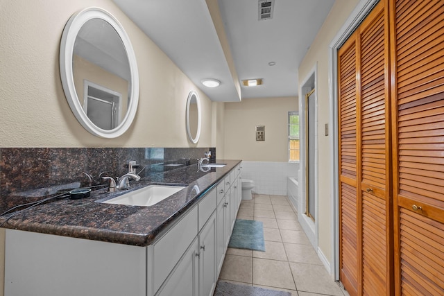 2234 Kelly Dr, Pearland, TX 77581 - bathroom with a closet, tile patterned floors, toilet, and double vanity