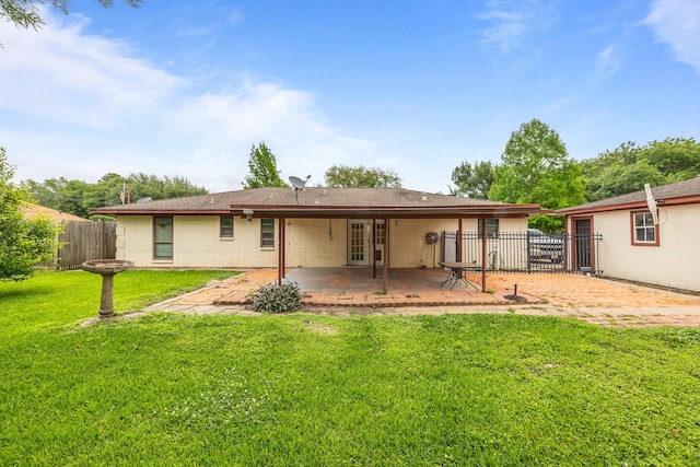 2234 Kelly Dr, Pearland, TX 77581 - back of house featuring a patio area, brick siding, and french doors