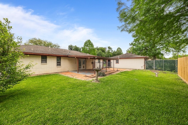 2234 Kelly Dr, Pearland, TX 77581 - rear view of house featuring a patio area, french doors, and brick siding