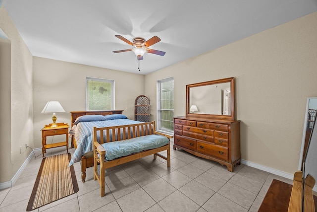 2234 Kelly Dr, Pearland, TX 77581 - bedroom with baseboards, light tile patterned flooring, and a ceiling fan