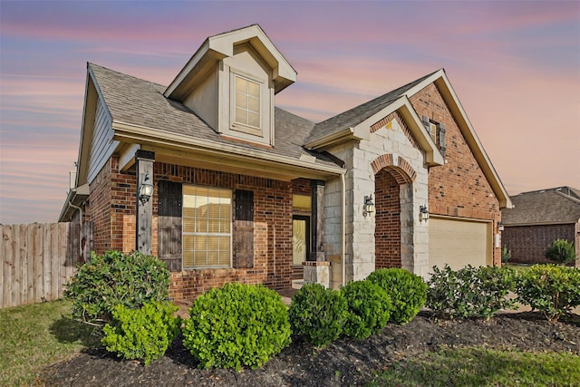 4310 Treccia Ct, Katy, TX 77493 - view of front of home with brick siding, fence, roof with shingles, and an attached garage