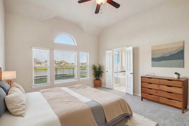 4310 Treccia Ct, Katy, TX 77493 - bedroom featuring light carpet, high vaulted ceiling, connected bathroom, a ceiling fan, and baseboards