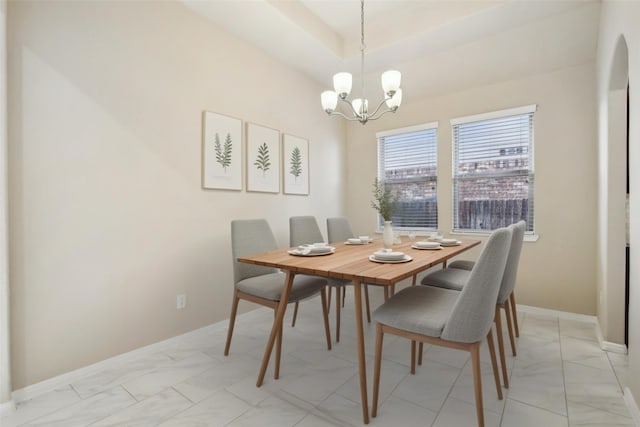 4310 Treccia Ct, Katy, TX 77493 - dining room featuring a chandelier, light marble finish flooring, and baseboards