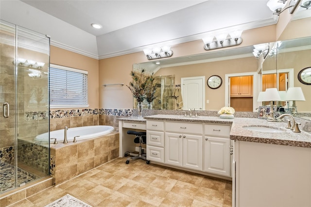 bathroom with two vanities, a shower stall, a sink, and a garden tub