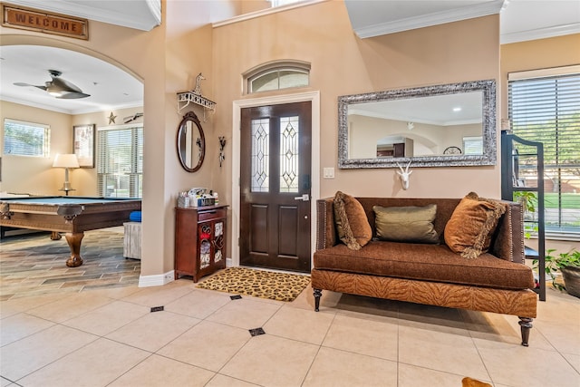 entryway featuring crown molding, billiards, and ceiling fan
