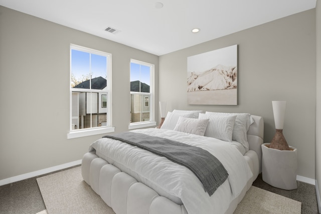 bedroom with carpet, visible vents, baseboards, and recessed lighting