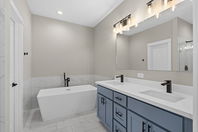 bathroom featuring a sink, double vanity, a stall shower, and marble finish floor