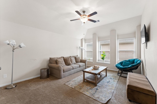 carpeted living area with baseboards, a ceiling fan, lofted ceiling, and visible vents