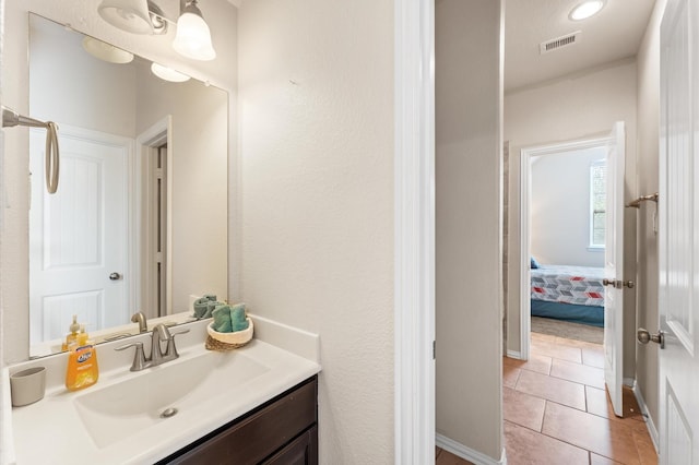 bathroom featuring vanity, tile patterned flooring, and visible vents