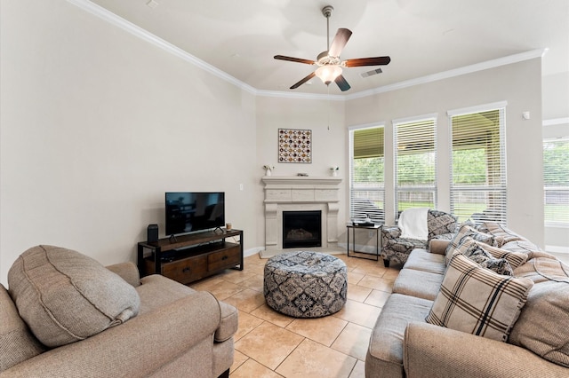 living room with crown molding, a wealth of natural light, and light tile patterned floors