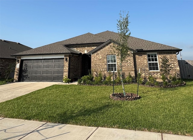 single story home featuring concrete driveway, brick siding, a garage, and a front lawn