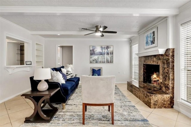 living room featuring ornamental molding, a healthy amount of sunlight, and light tile patterned floors