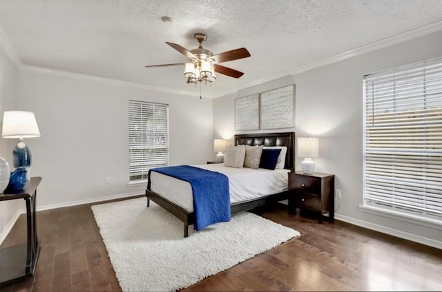 8315 Lichen Ln, Spring, TX 77379 - bedroom featuring dark wood-style flooring, baseboards, ornamental molding, a textured ceiling, and a ceiling fan