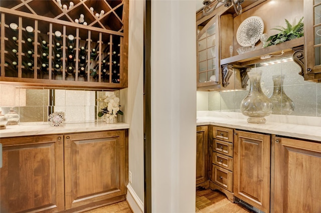 wine room featuring light wood-style flooring