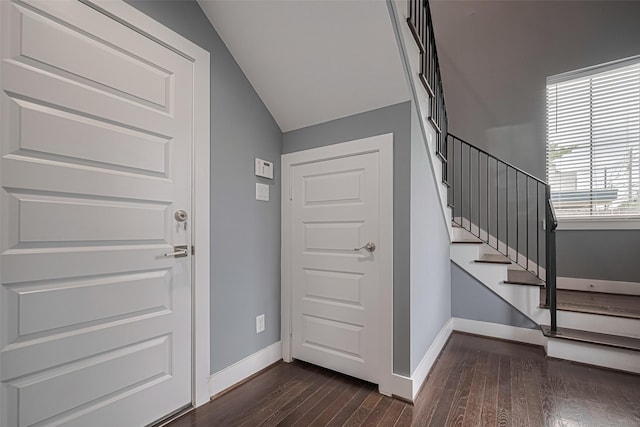 4318 E Center St, Houston, TX 77007 - entryway featuring stairway, baseboards, vaulted ceiling, and dark wood finished floors