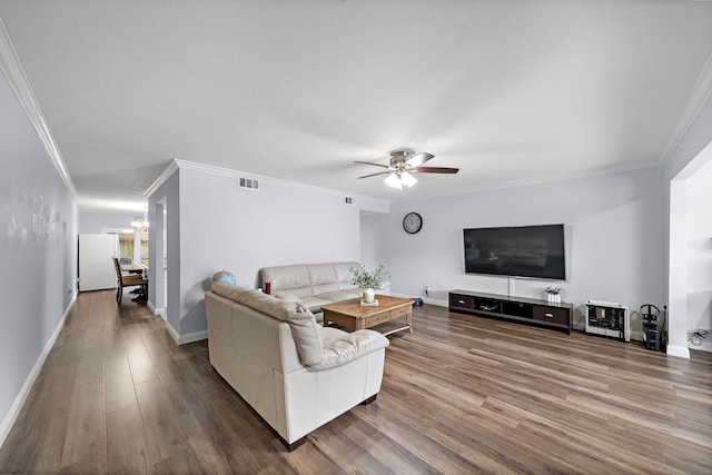 12633 Memorial Dr Unit 83, Houston, TX 77024 - living area featuring ceiling fan with notable chandelier, baseboards, wood finished floors, visible vents, and ornamental molding