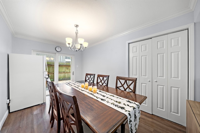 12633 Memorial Dr Unit 83, Houston, TX 77024 - dining space featuring ornamental molding, dark wood-type flooring, and a notable chandelier