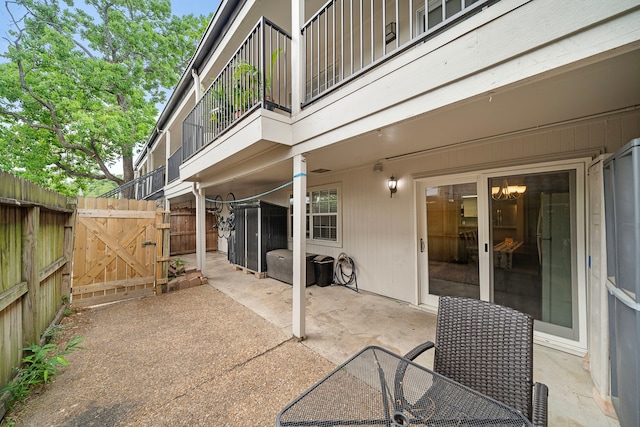 12633 Memorial Dr Unit 83, Houston, TX 77024 - view of patio / terrace with a gate, fence, and a balcony