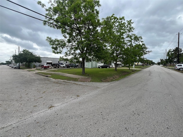 view of road featuring sidewalks and street lights