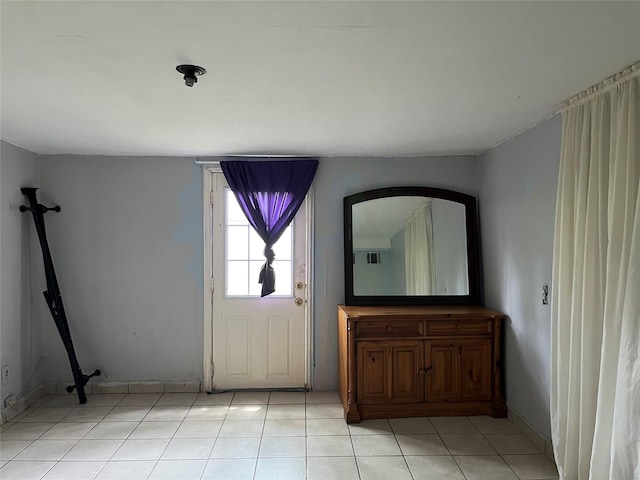 entryway featuring light tile patterned floors