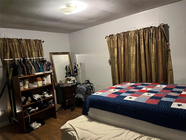 bedroom with wood finished floors