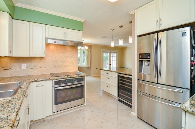 kitchen featuring stainless steel appliances, wine cooler, crown molding, under cabinet range hood, and light tile patterned floors